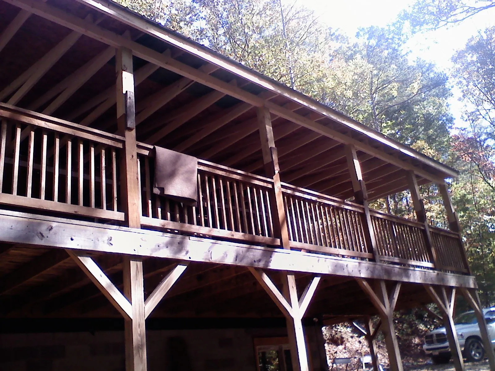 Timber framing under a new elevated porch and deck — Roof Leak Repair in Poolville by Roofing Brothers